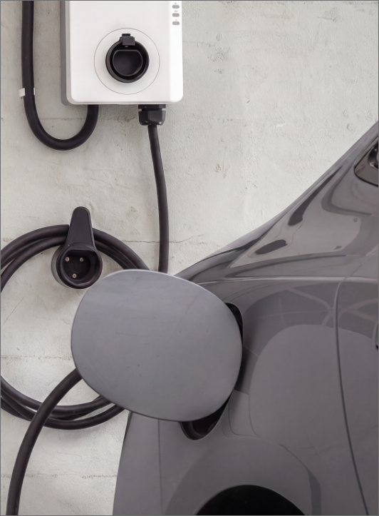 Electric vehicle charging from a wall-mounted home charger
