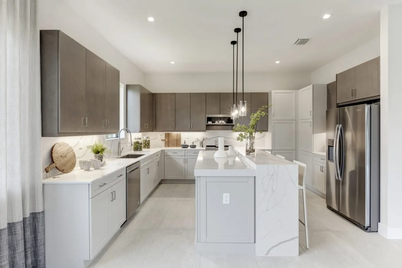 Kitchen with quartz counters and pendant lighting
